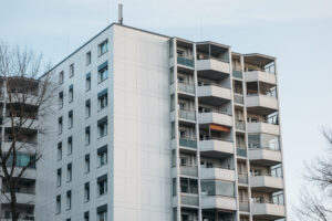apartment building exterior against a light blue s 2026 03 25 22 58 11 utc