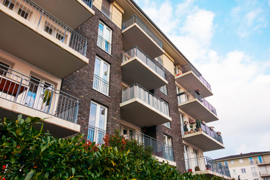 Rent Guarantor Companies in Japan Compared: What to Look For brown and brick facaded apartment building with gr 2026 03 25 22 44 17 utc