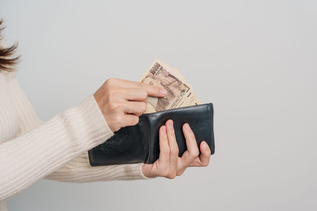 Renting an Apartment in Japan: What Foreign Residents Should Know woman hand holding japanese yen banknote with wallet. thousand y