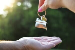 realtor handing a man the key to his new home sol 2026 01 08 22 54 36 utc