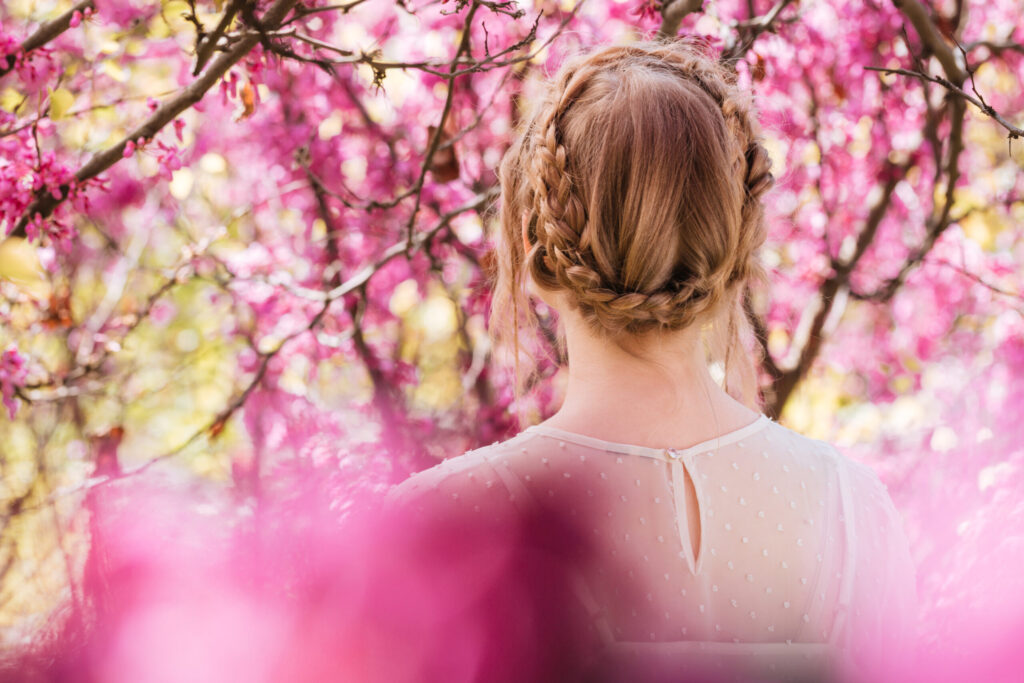 Visa Renewal in Japan: Timing, Documents, and Common Reasons for Delays blonde young woman standing in spring blooming garden