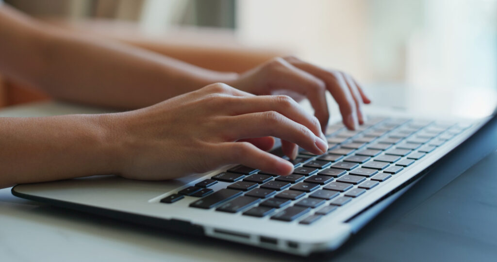 Writing a Rirekisho as a Foreign Job Seeker in Japan: A Section-by-Section Guide woman type on laptop computer