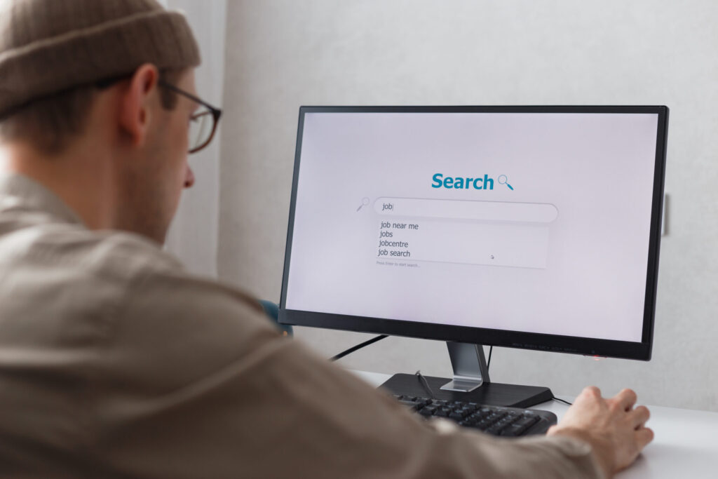 Rent Guarantor Companies in Japan Compared: What to Look For unemployed man looking for work on the internet sitting at the computer at home