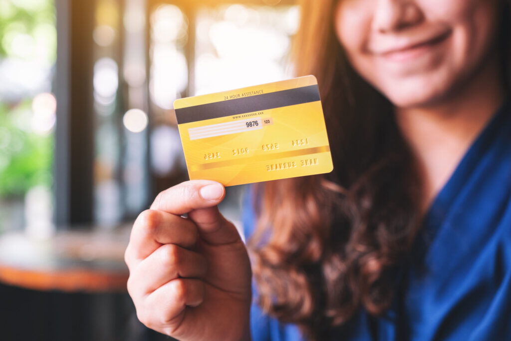 Credit Cards in Japan for Foreigners: How to Get Approved a beautiful asian woman holding credit card for shopping