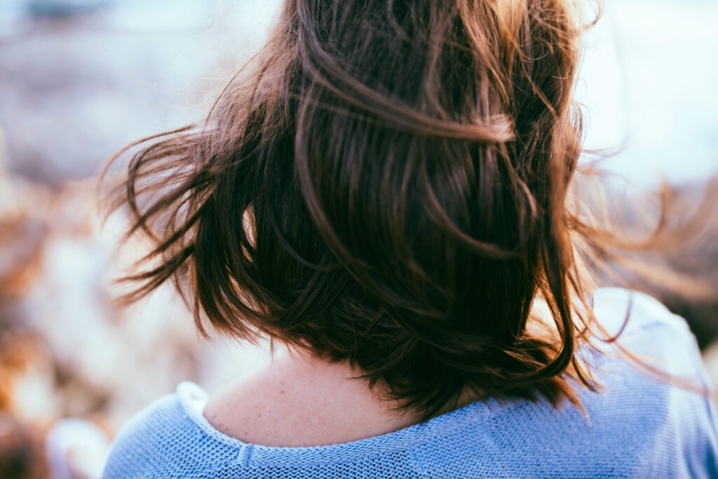 What Is a Certificate of Eligibility and Why You Need One woman with brown hair in blue sweater outside 2026 03 10 00 03 57 utc